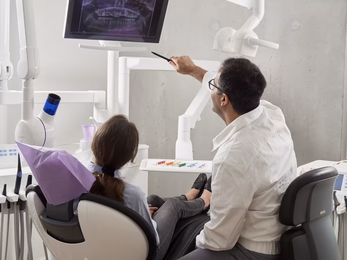 Dentist performing tooth extraction at Empire Dental Clinic Dublin