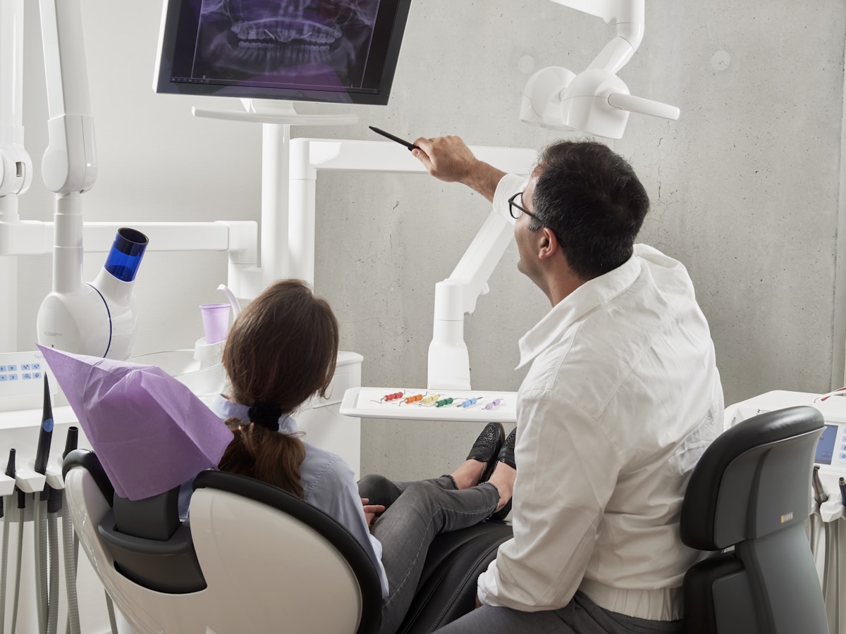 Dentist fitting an implant crown at Empire Dental Clinic Dublin