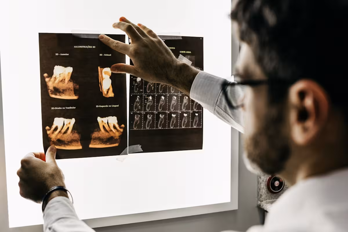 Dentist examining teeth during restorative dental procedure at Empire Dental Clinic